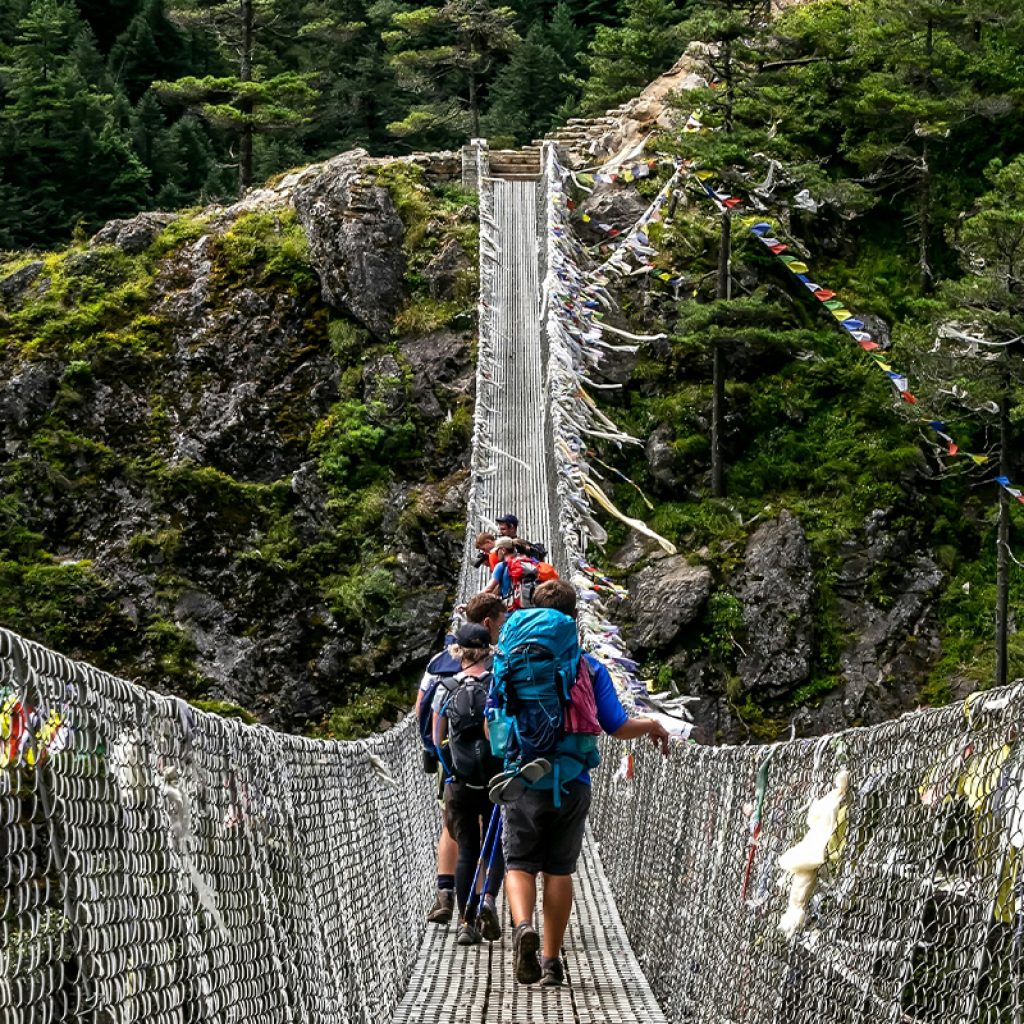 People Crossing The Suspension Bridge During Everest Base Camp Trek